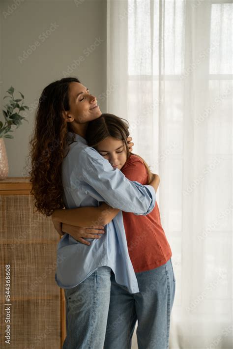 hugging mother and daughter